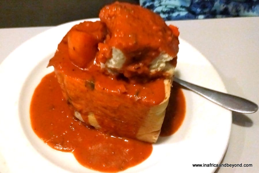 Bunny chow - bread loaf covered with curry