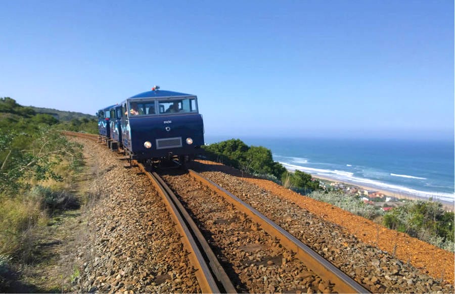11 Best Things to Do in Mossel Bay 6 Blue train against ocean backdrop