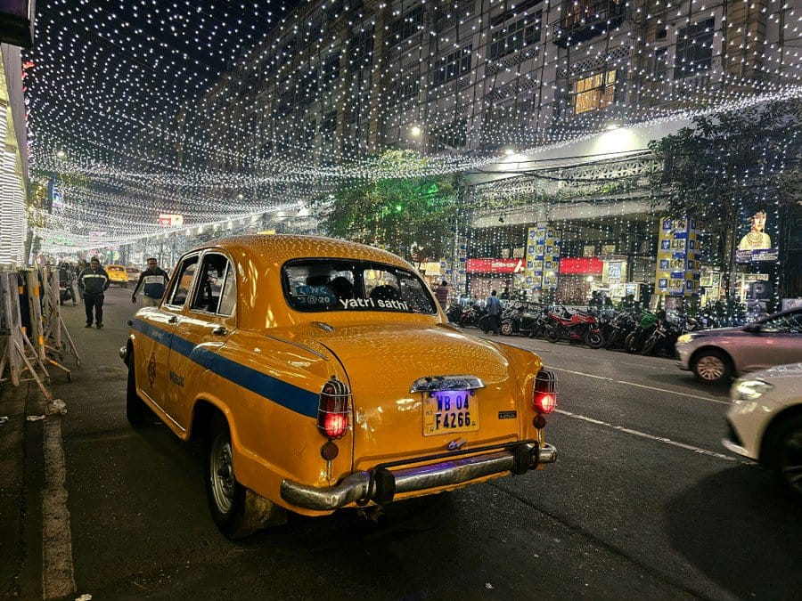 yellow taxi cab driving down a street - Make Your Overseas Trip Stress-Free